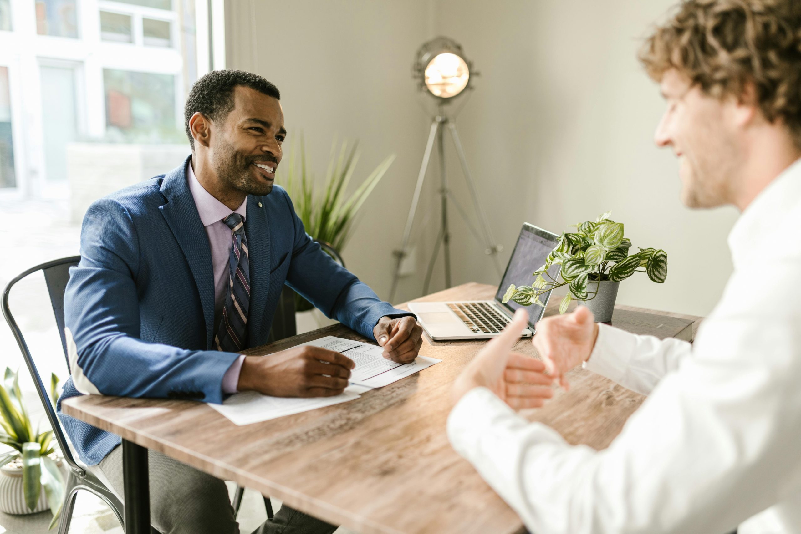 A PEO consultant helping a client learn about PEOs